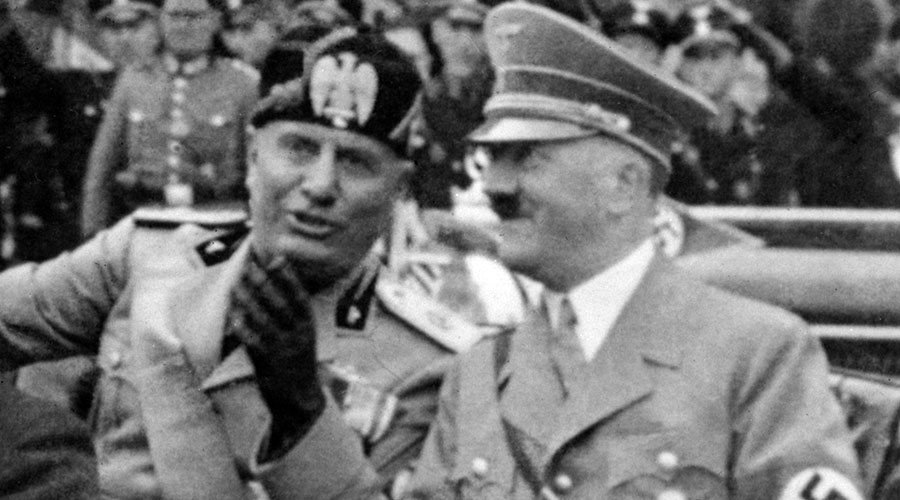 A picture taken in September 1937, in Munich, shows German Chancellor Adolf Hitler (R) riding in a car with Italian dictator Benito Mussolini