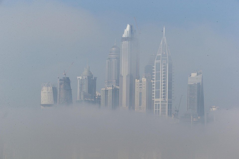 Buildings are partially obscured in the Dubai Marina as the sun starts to burn the morning fog away. 