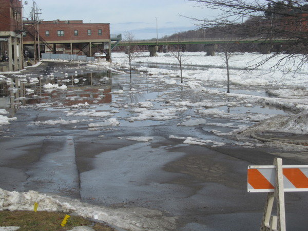 Unseasonably warm temperatures earlier this week caused an early breakup of ice on the Kennebec River, causing minor flooding in low-lying areas