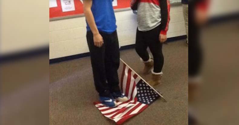 kid stands on flag