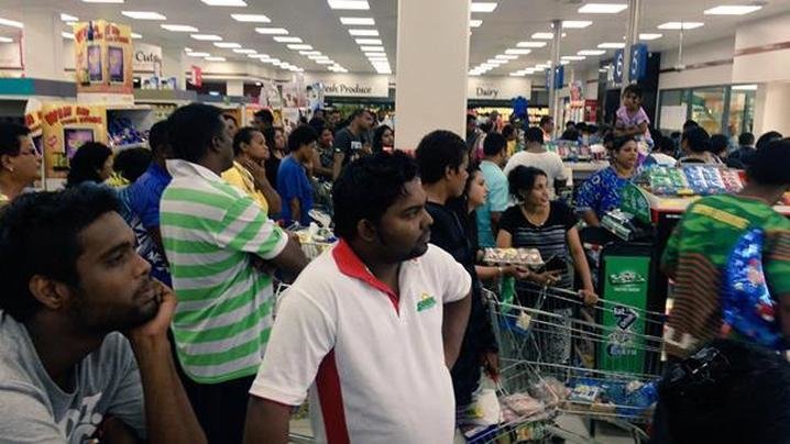 Click to enlarge One resident shared this photo of queues of people lining up to stock up on supplies.