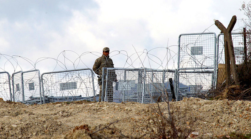 man and fences