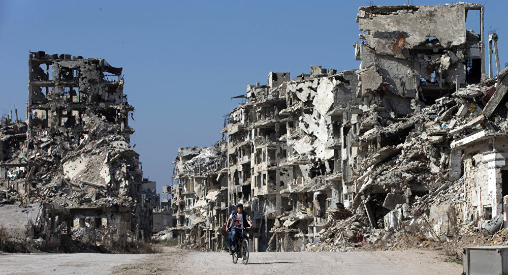 Boy rides bike in Homs