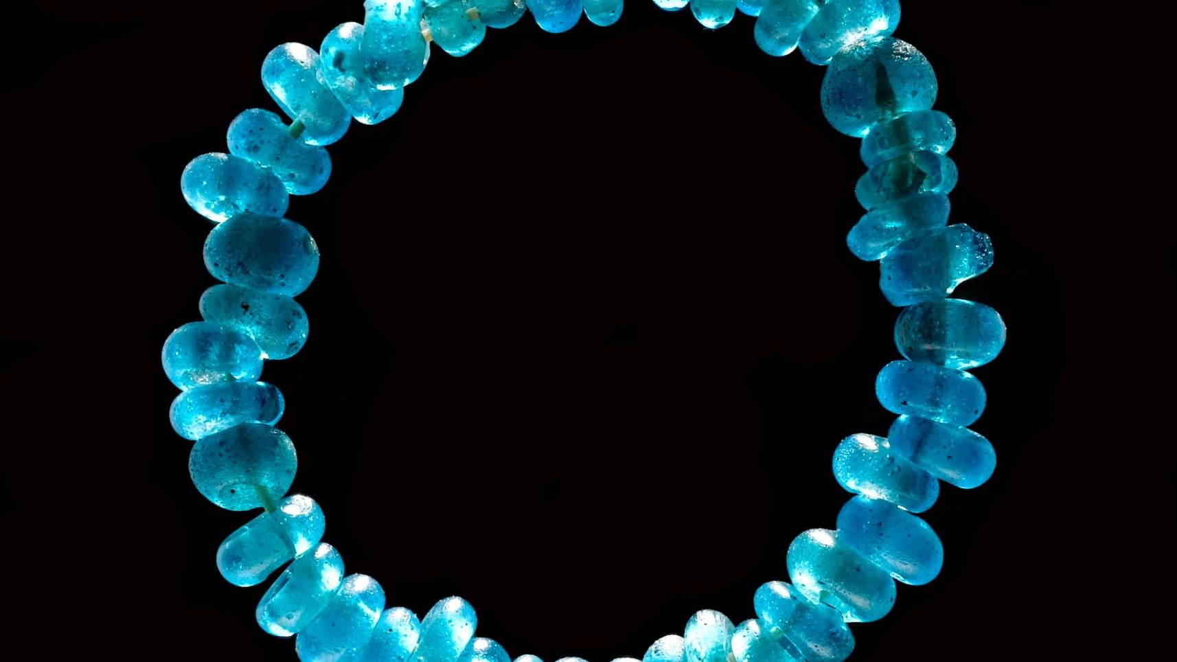 Click to enlarge Detail of a string of beads.