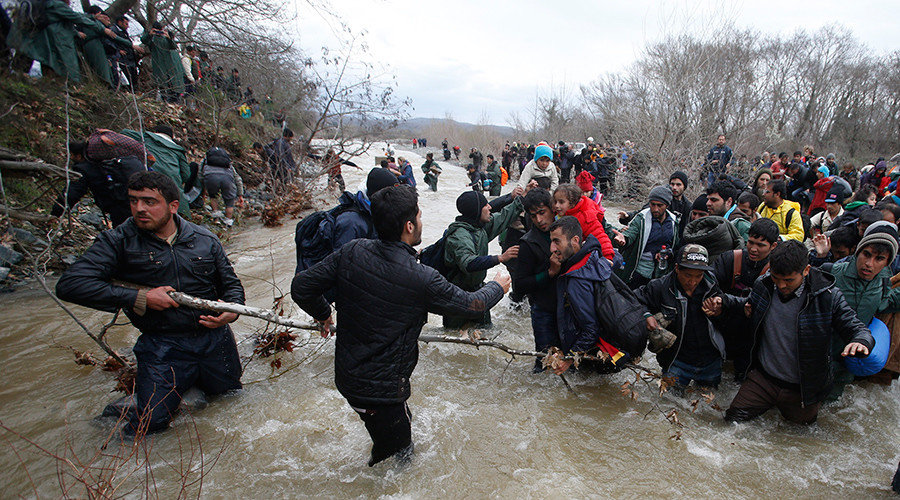 refugees cross Greek-Macedonian border