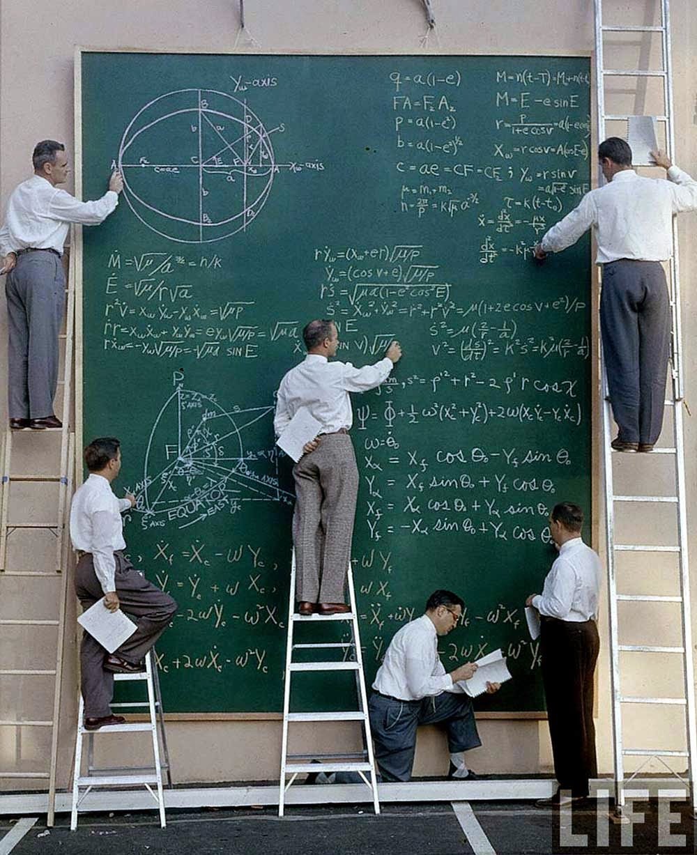 nasa scientists at black board