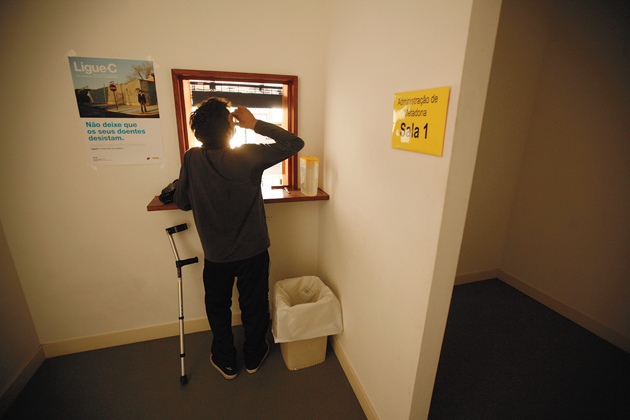Click to enlarge A patient drinks a dose of methadone at the Taipas rehabilitation clinic in Lisbon, Portugal
