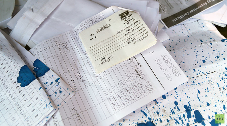 Islamic State documents, including invoices, which militants abandoned while retreating in haste