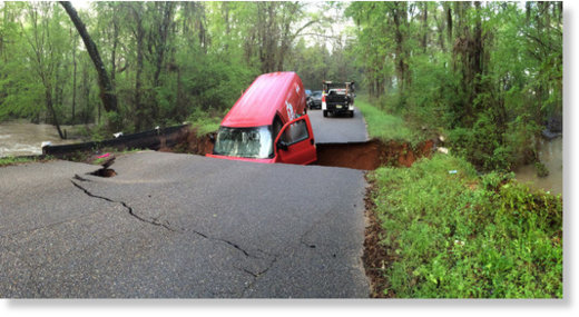 A Coca-Cola truck gets swallowed up by a sink hole. 