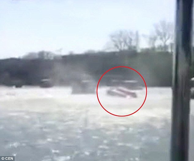 a powerful waterspout led to one of the boats being blown ferociously and turned upside down