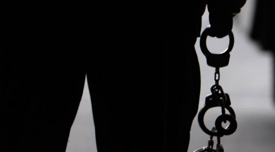Click to enlarge man with handcuffs