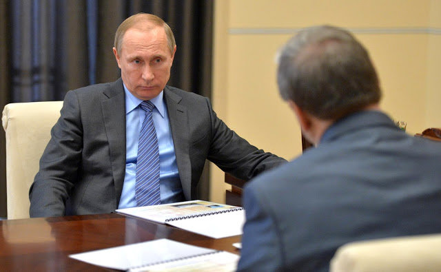 Click to enlarge Putin at desk