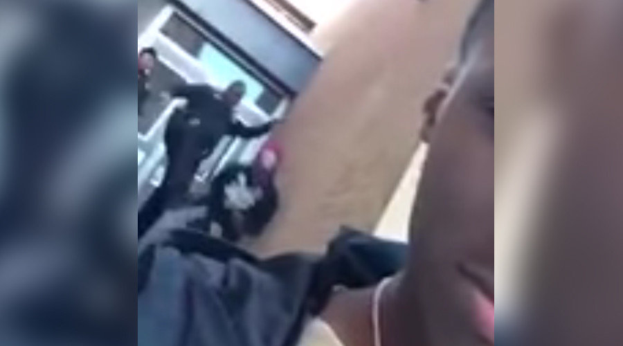 cop kicks student