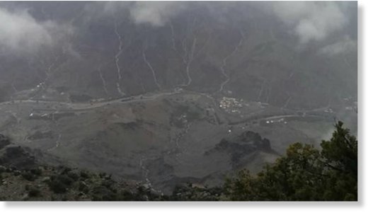 Picture shared on social media shows rainwater running off from mountains to a valley in Oman. 