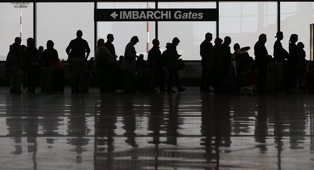 Click to enlarge people waiting in line airport strike italy
