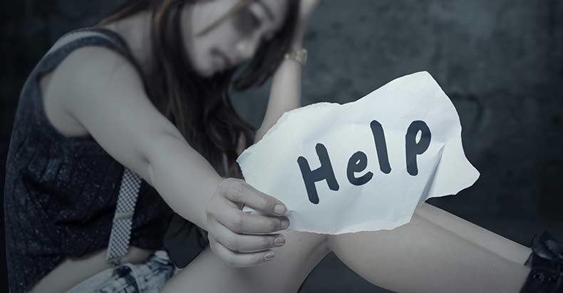 domestic violence woman sign help