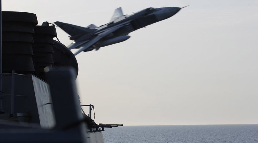 A Sukhoi Su-24 jet makes a low altitude pass by the USS Donald Cook