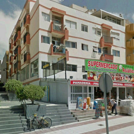 Click to enlarge Apartment block and market