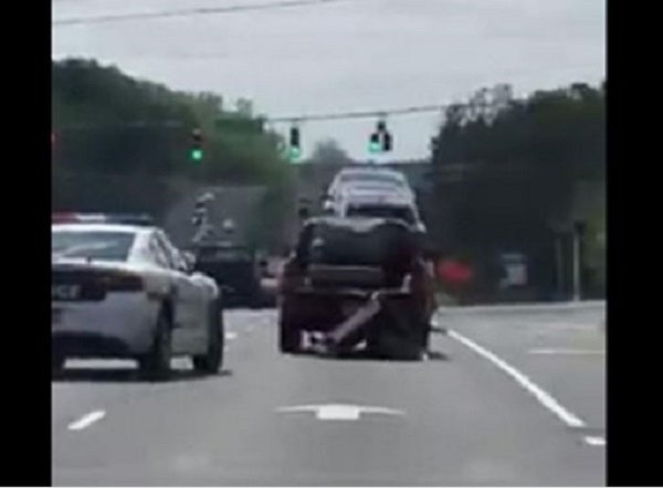 truck dragging sofa