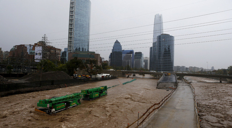 Click to enlarge Crane on flooded street in Santiago