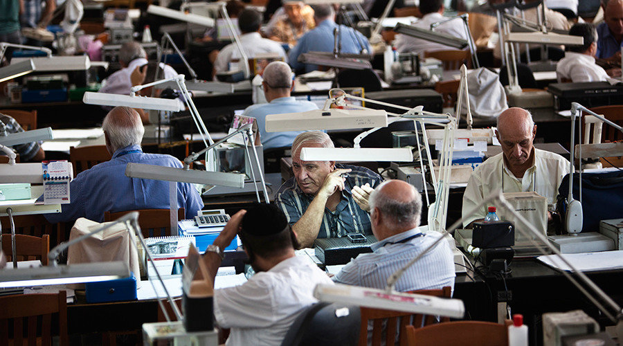 Diamond dealers work on the trading floor of Israel's diamond exchange