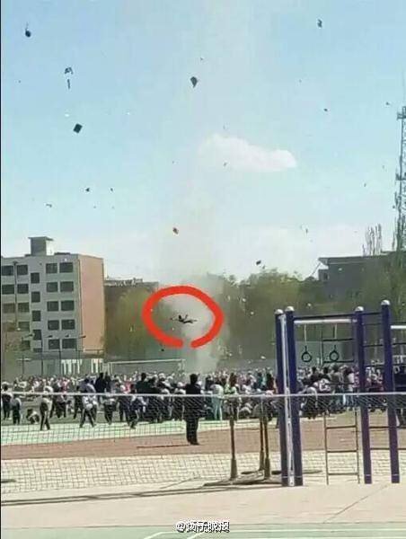 Sudden “dust devil” lifts up boy in school playground in Guazhou, China