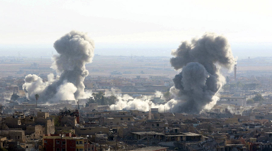 Smoke rises from the site of U.S.-led air strikes in the town of Sinjar, Iraq
