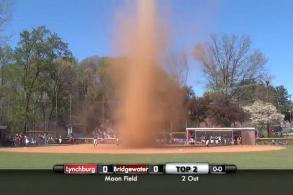 A dust devil interrupts a college softball game in Virginia