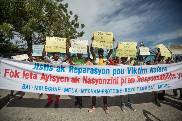 Click to enlarge haiti protests cholera