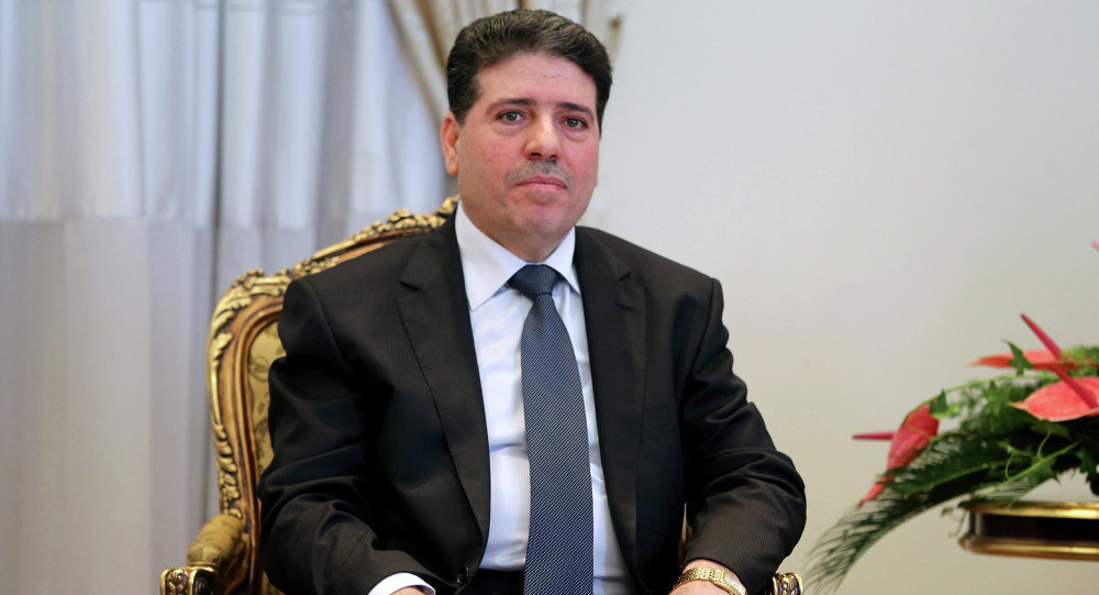 Click to enlarge Syrian Prime Minister Wael Nader Halqi