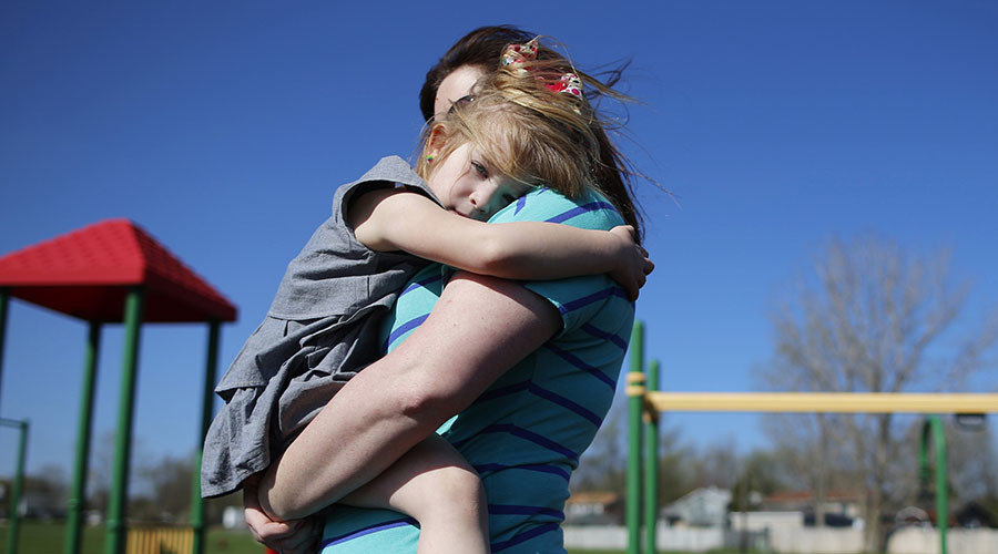 mom embracing child