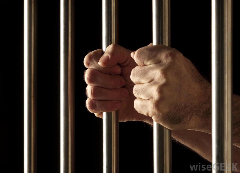 jail bars_hands