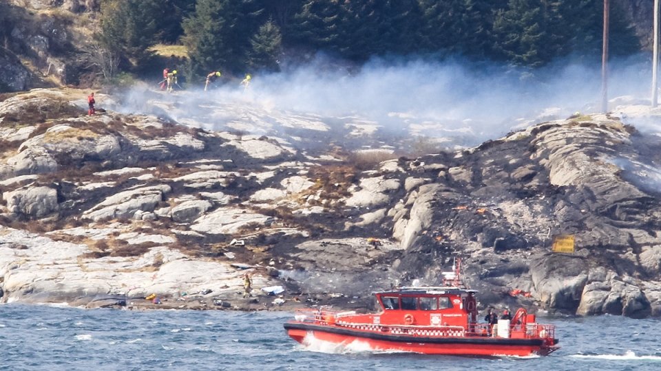 A search and rescue vessel patrols off the coast of the island of Turoey, near Bergen, Norway, as emergency workers attend the scene after a helicopter crashed believed to be have 13 people aboard, Friday, April 29, 2016. 