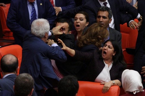 Ruling AK Party and pro-Kurdish Peoples' Democratic Party (HDP) lawmakers scuffle during a debate at the Parliament in Ankara, Turkey