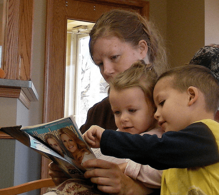 Click to enlarge mother reading children