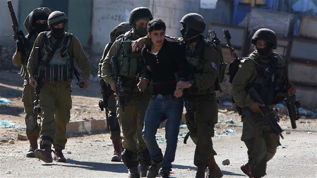 Click to enlarge Israeli forces arrest a Palestinian man