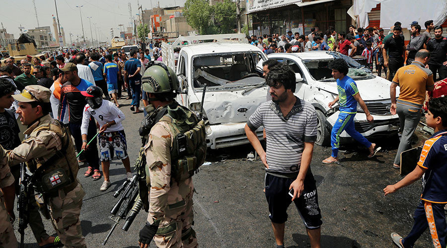 People gather at the scene of a car bomb attack in Baghdad's mainly Shi'ite district of Sadr City, Iraq, May 11, 2016