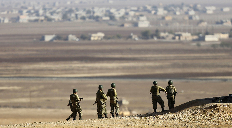 Click to enlarge Turkish soldiers near the Turkish-Syrian border