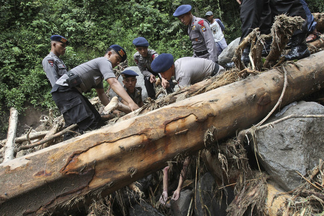 Click to enlarge Rescuers recover the body of a victim after a flood hit Dua Warna waterfall in Sibolangit, North Sumatra, Indonesia, Monday, May 16, 2016. Nearly two dozen students were missing in rain-triggered floods and landslides at the waterfall which is popular tou