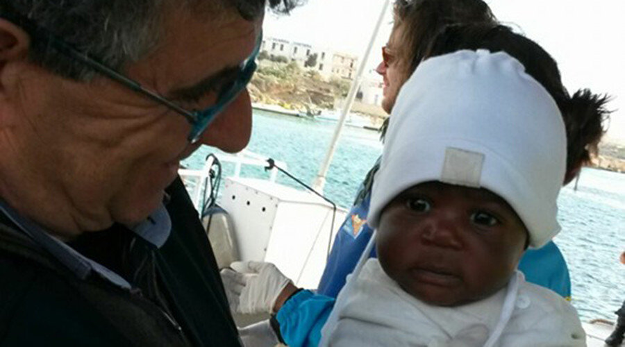 Click to enlarge Baby migrant survivor