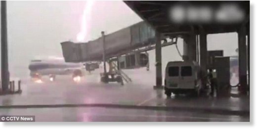 The bolt of lightning makes the plane, which was parked at the airport, flash a vivid purple