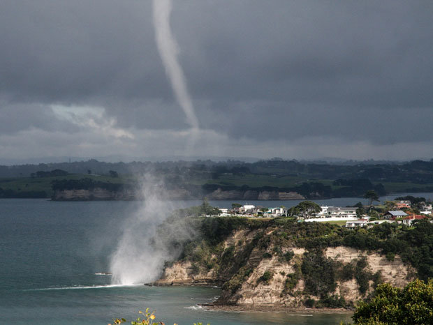 Artist John Charles snapped photos of the water spout from Roberts Road, Gulf Harbour, as it moved from sea to land.