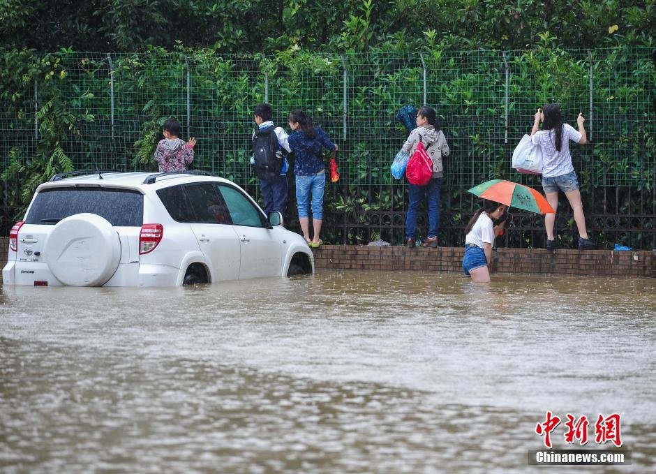 Click to enlarge Heavy rainfall hits central China's Wuhan in Hubei province on June 1, 2016, resulting in serious flooding in the downtown area.