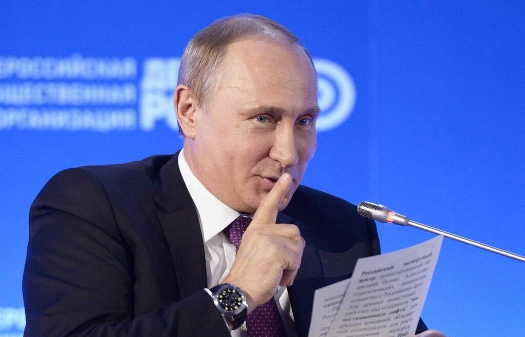 Putin sly smile