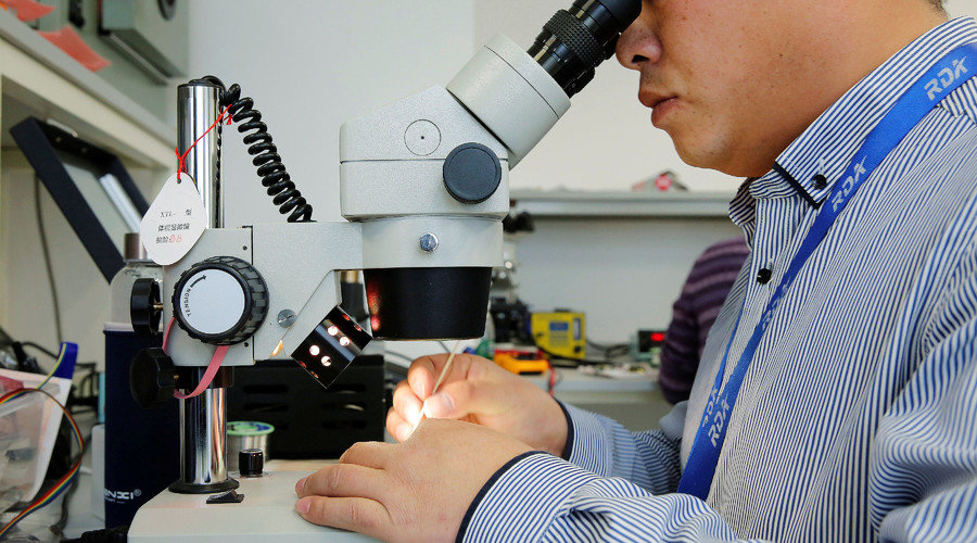 Click to enlarge Man and a microscope