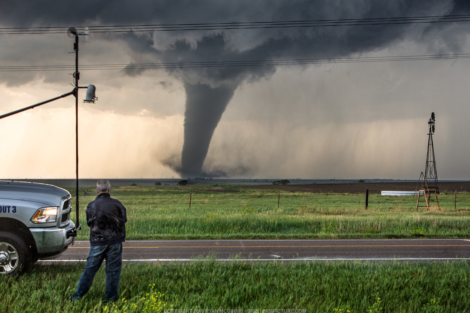 Storm chaser scientist Tim Marshall observes a tornado near Dodge City, KS