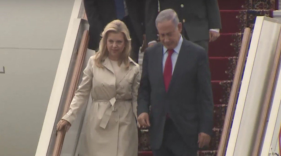 Netanyahu, accompanied by his wife Sara