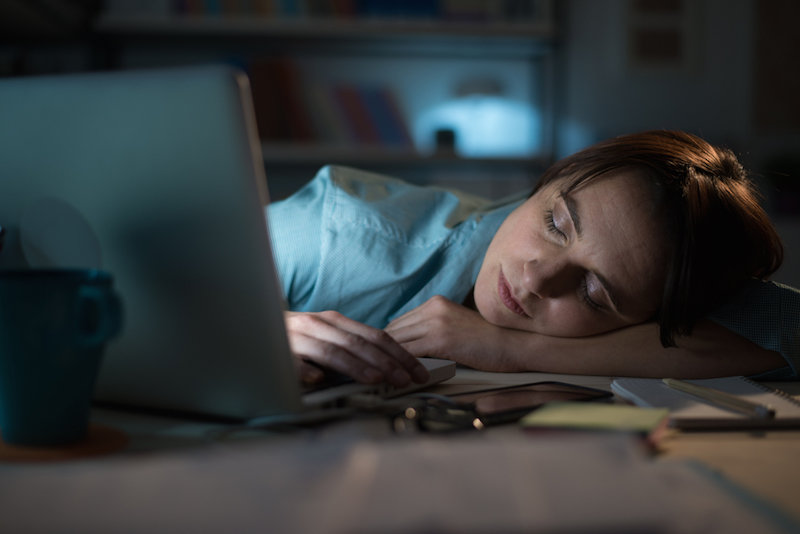 woman sleeping at work