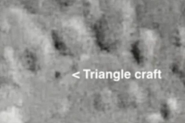 Creepy 'miles-long' triangle floats across the moon's surface 