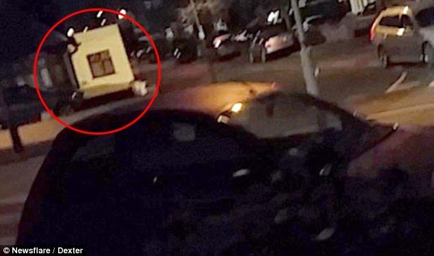 After: The man videoed a flash of bright light (circled), which occurred before the explosions were heard 